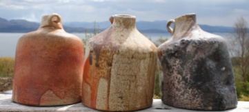 Patricia Shone. Anagama fired squatty bottles with a view to the mainland.